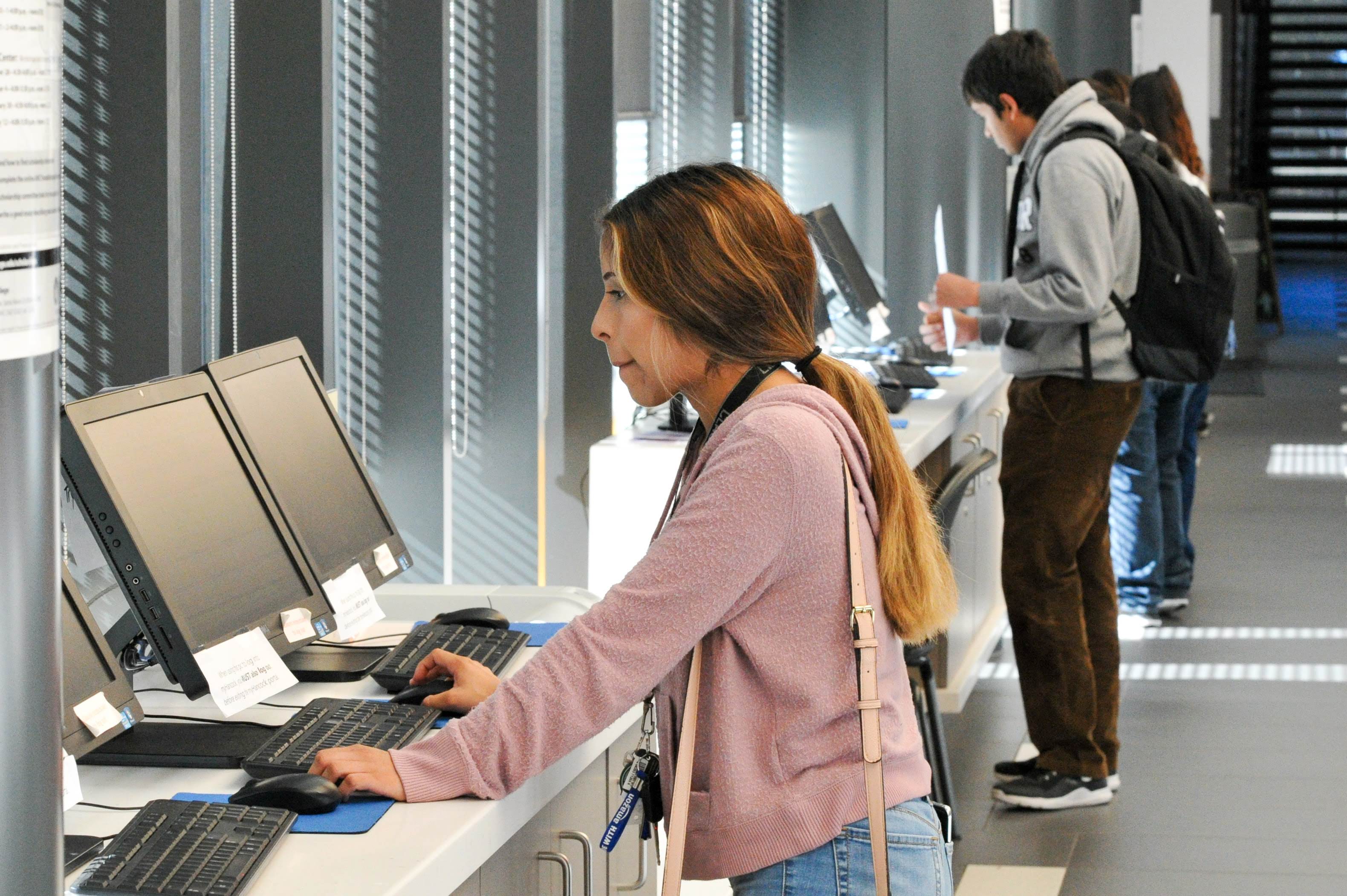 A young female student using a computer.