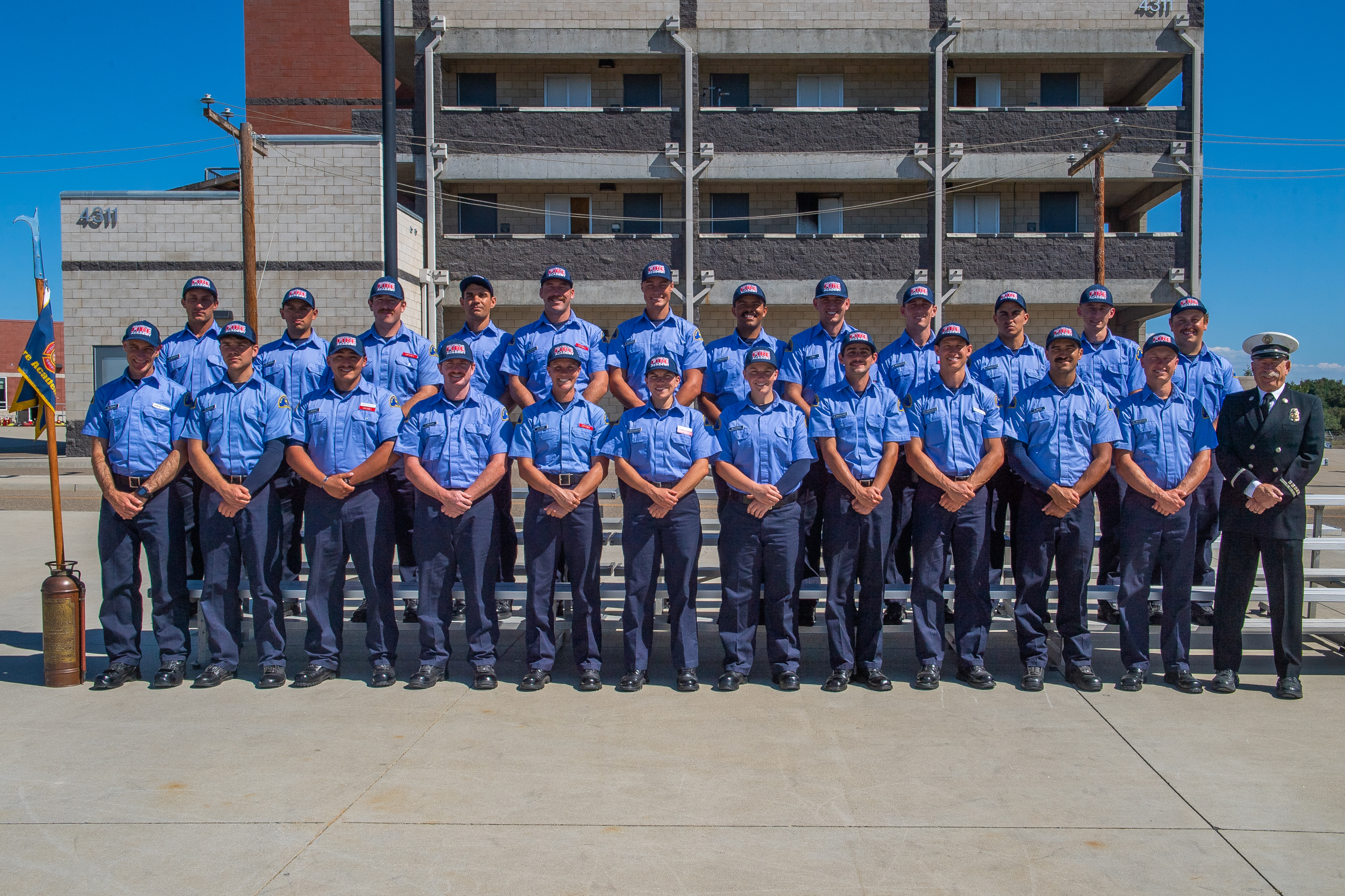 Photo Caption: Graduates of AHC Fire Academy Battalion 150 stand with retired firefighter Bruce Janatsch (far right), a graduate of the academy’s first class in 1972.    