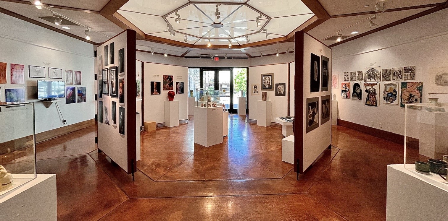 Student artwork hangs in the Ann Foxworthy Gallery at Allan Hancock College. 