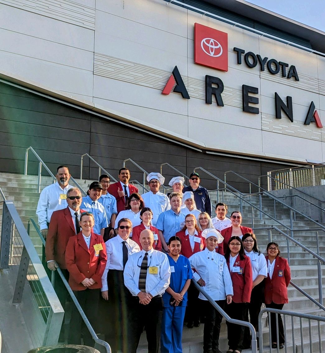 Allan Hancock College SkillsUSA Team standing on steps and smiling. 