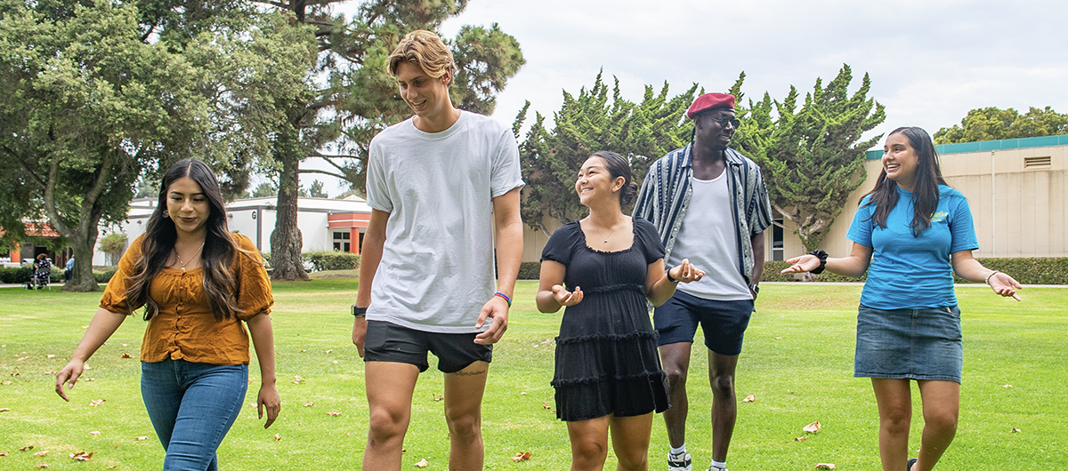 Students walking on grass