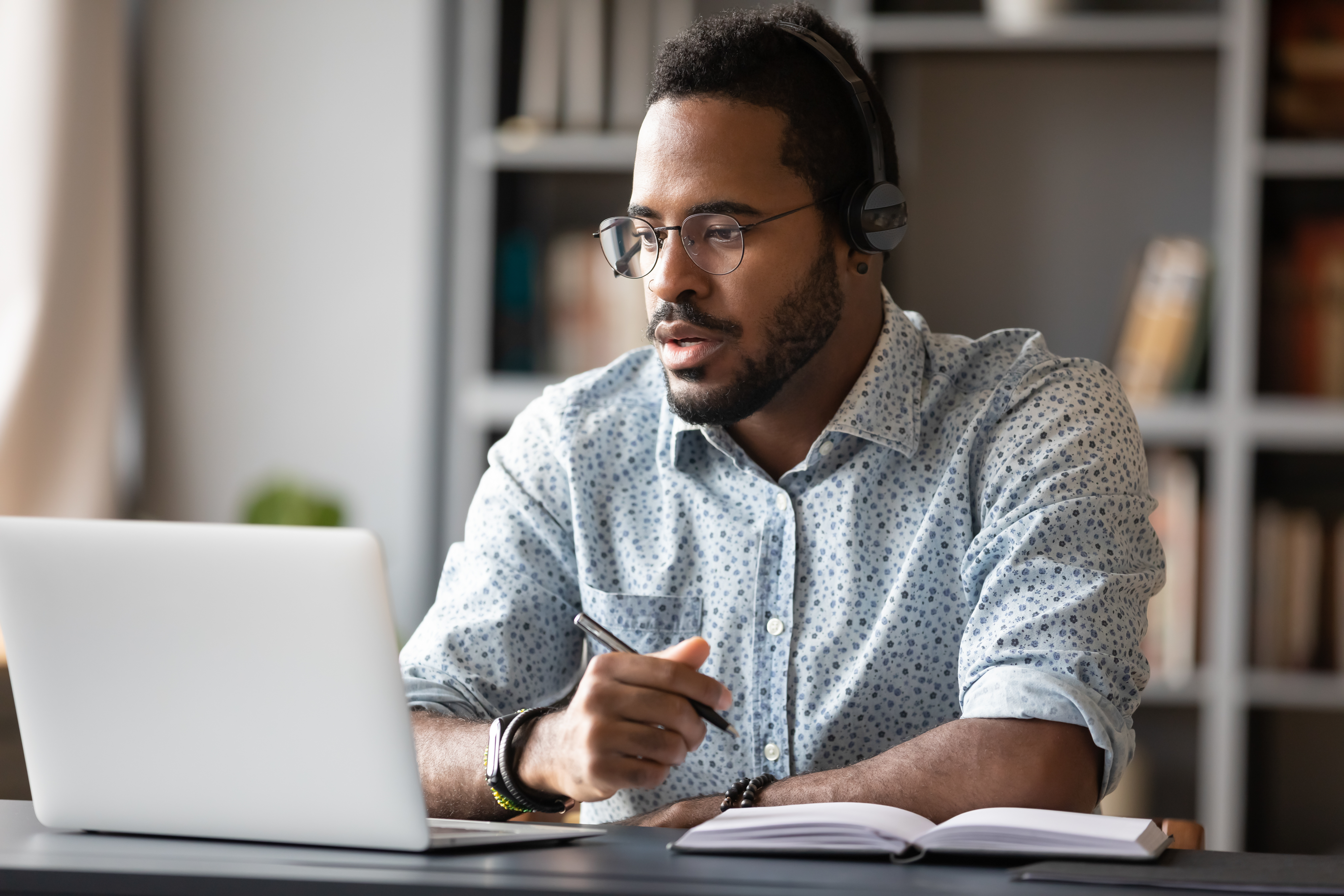 A man sitting infront of a computer