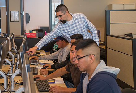 Man in Career Center helping students