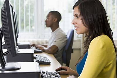 Woman on computer in classroom