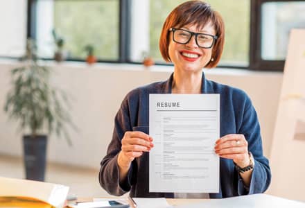woman holding a resume