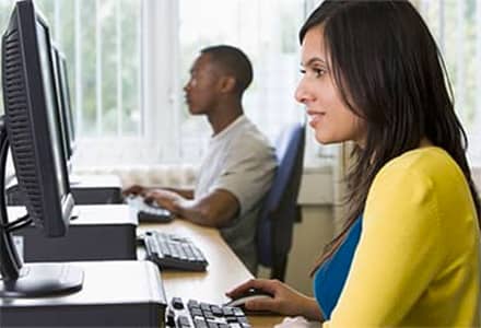 woman sitting at a computer