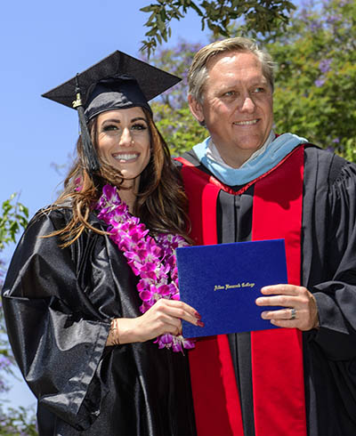 Female graduate receiving diploma