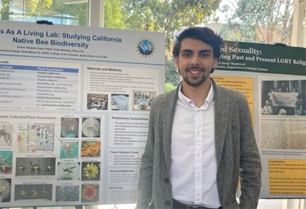 man standing in front of poster presentation