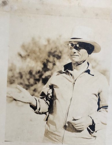 Allan Hancock stands with a specimen in hand