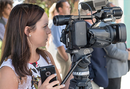 Woman with movie camera