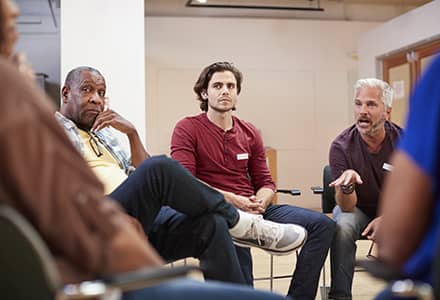 Men sitting in a circle